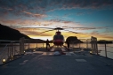 Tying down Atmosphere's helicopter at sunset from aboard Atmoshpere in Auchemo