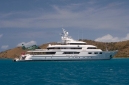 Motor yacht "Floridian" with her helicopter at anchor in North Sound