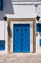 Traditional blue painted studded wooden door in Sidi Bou Said