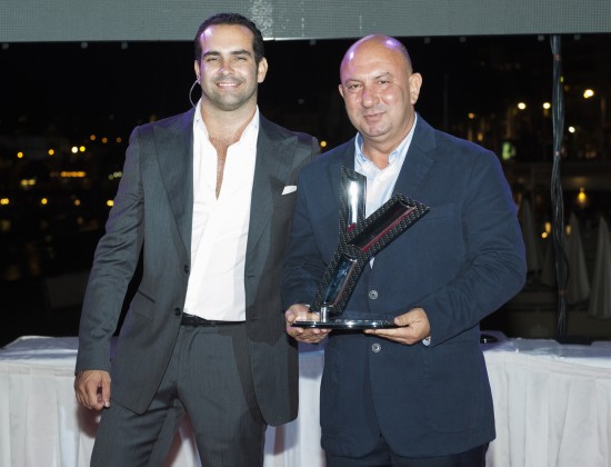 Notis Menelaou (left) Sales Manager at Gulf Craft receiving the Award fr...